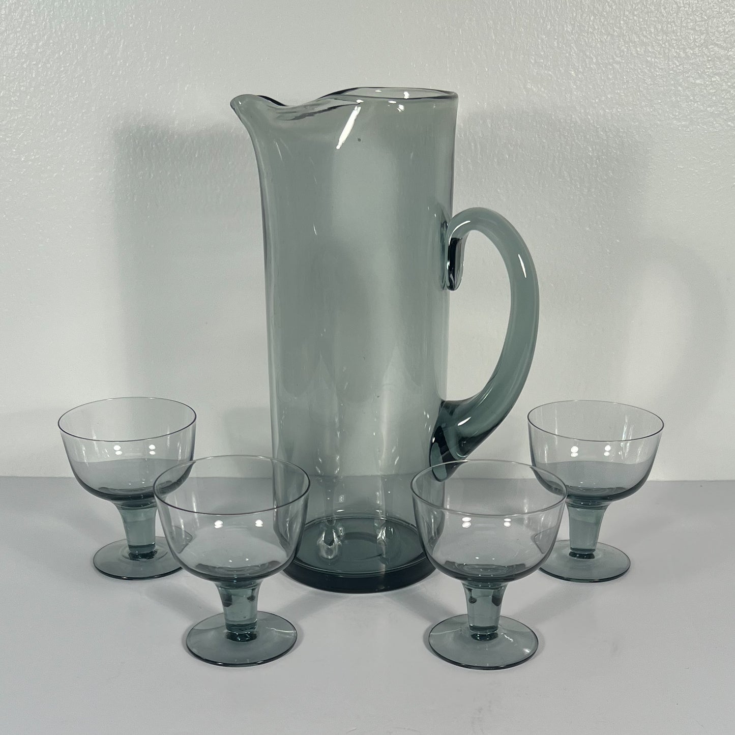 (19911) Midcentury Smoky Gray Pitcher and Four Footed Glasses