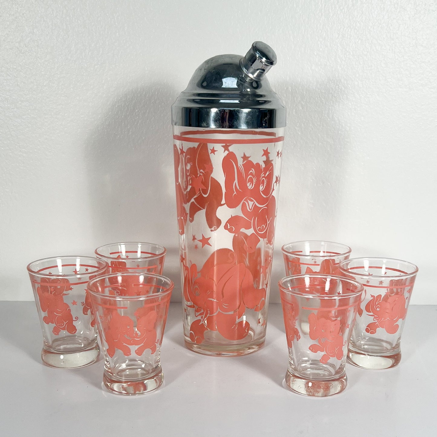 (24825) Midcentury Seeing Pink Elephants Shaker and Set of Six Glasses